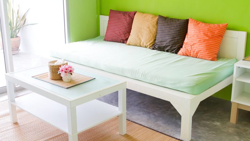 Colorful green room with couch