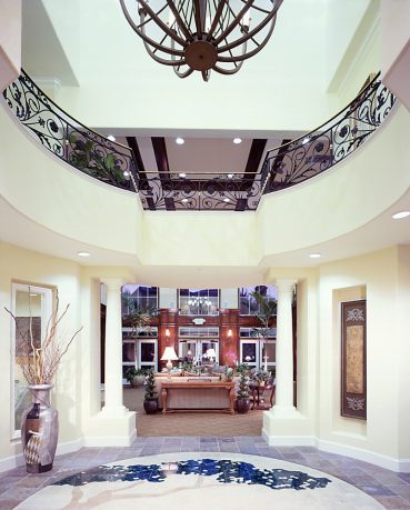 Elegant entry way with marble and chandelier