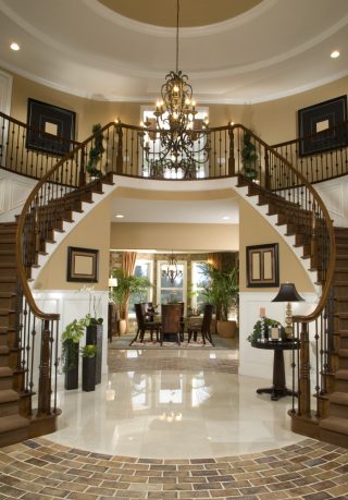 Glamorous entry way with double stairs