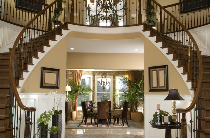 Glamorous entry way with double stairs