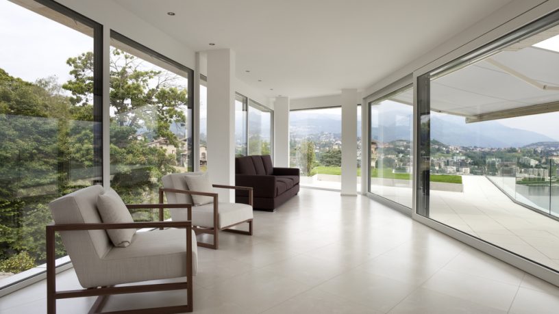 Glass house living room with view
