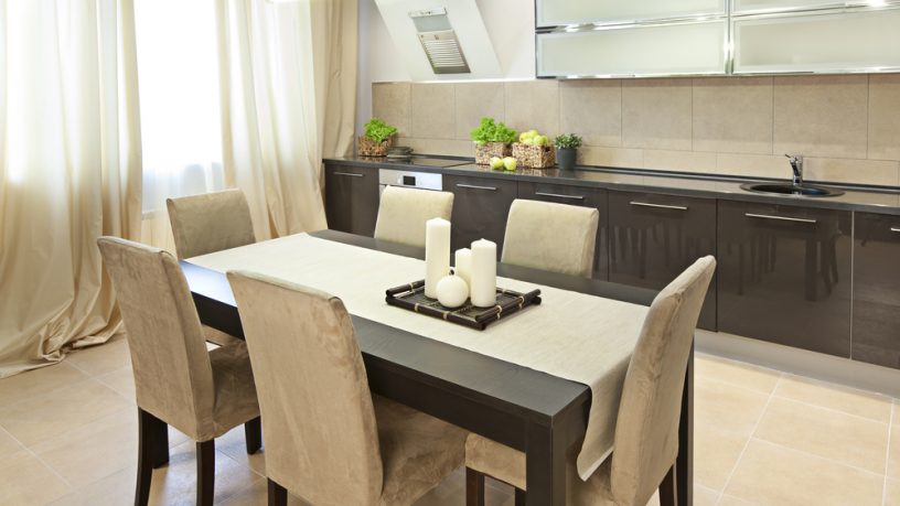 Great brown dining room with candles and drapes