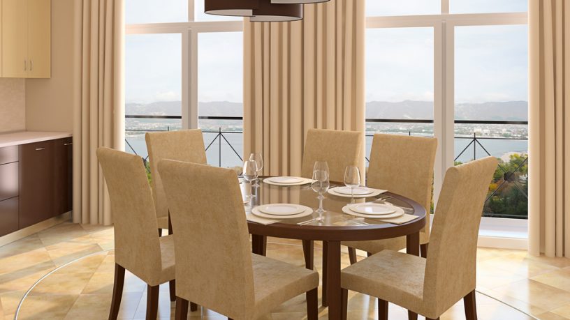 Marble dining room floor with beige chairs and wood table