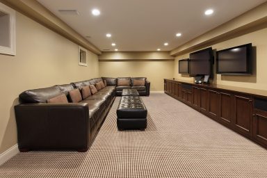 Nodern basement with 3 TVs