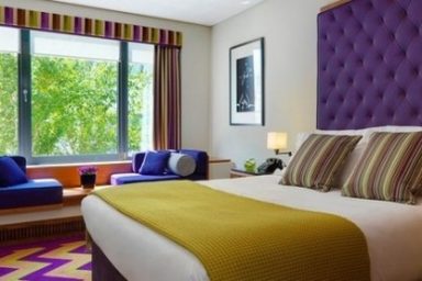 White, gold and purple bedroom