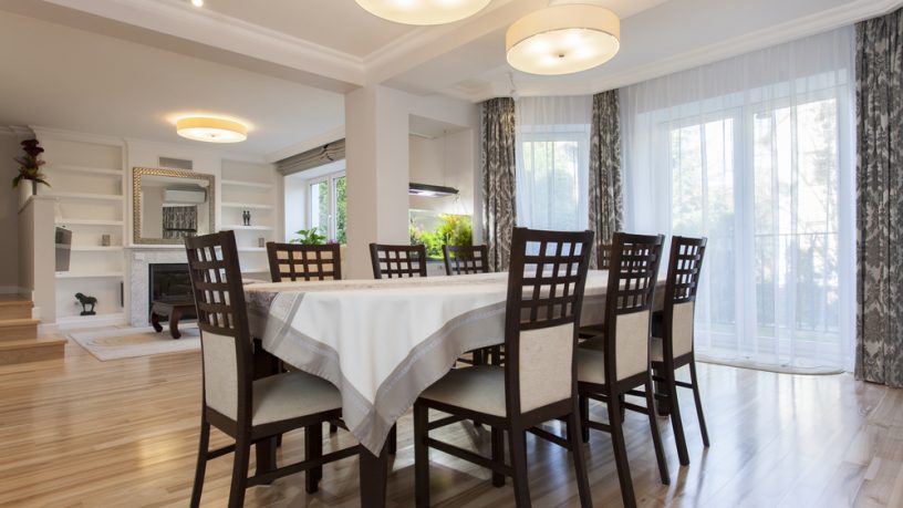Unique dining room with circle lamps and wood chairs