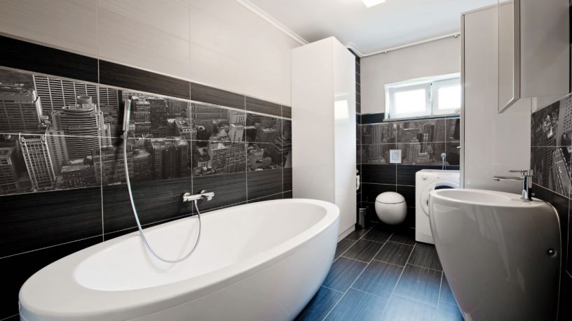 Modern bathroom with mural and white tub
